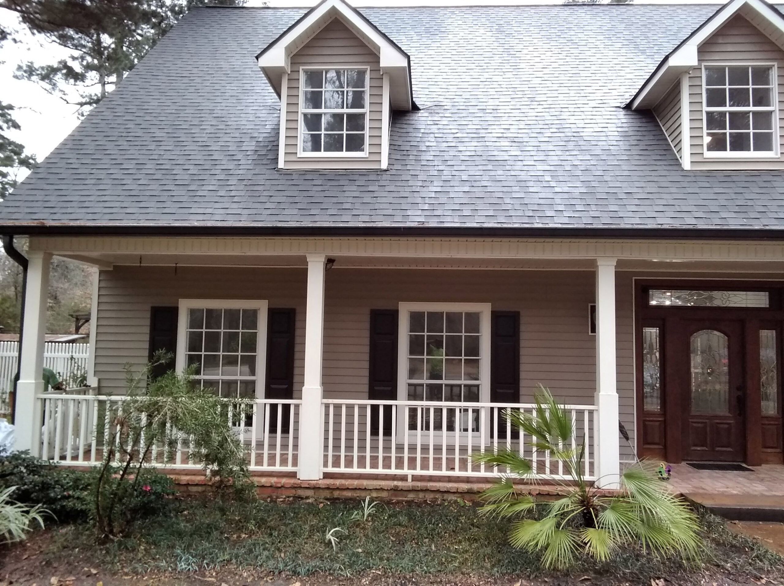 Cajun Soft Wash residential roof cleaning exterior window dirt