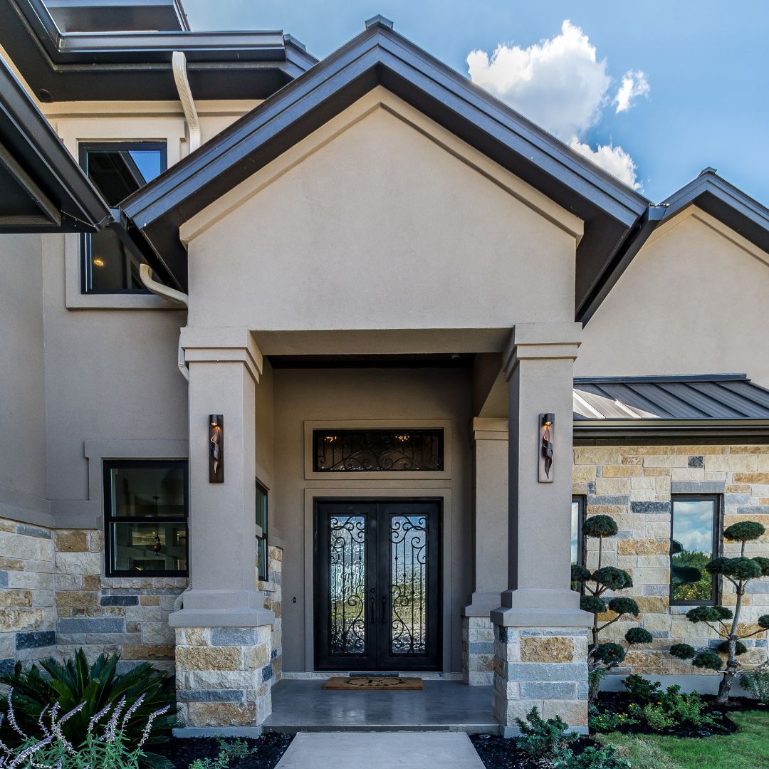 Stucco home entrance and sides cleaning